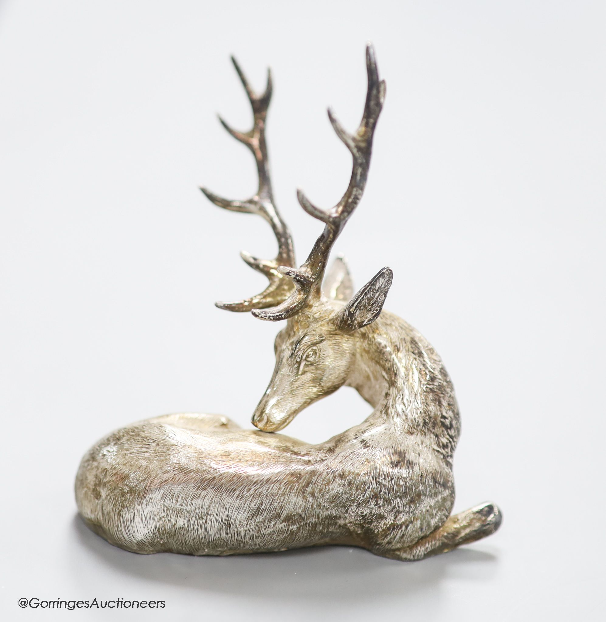 A modern silver miniature model of a recumbent stag C.F.H & Co, London, 1994, height 10.6cm, 170 grams.